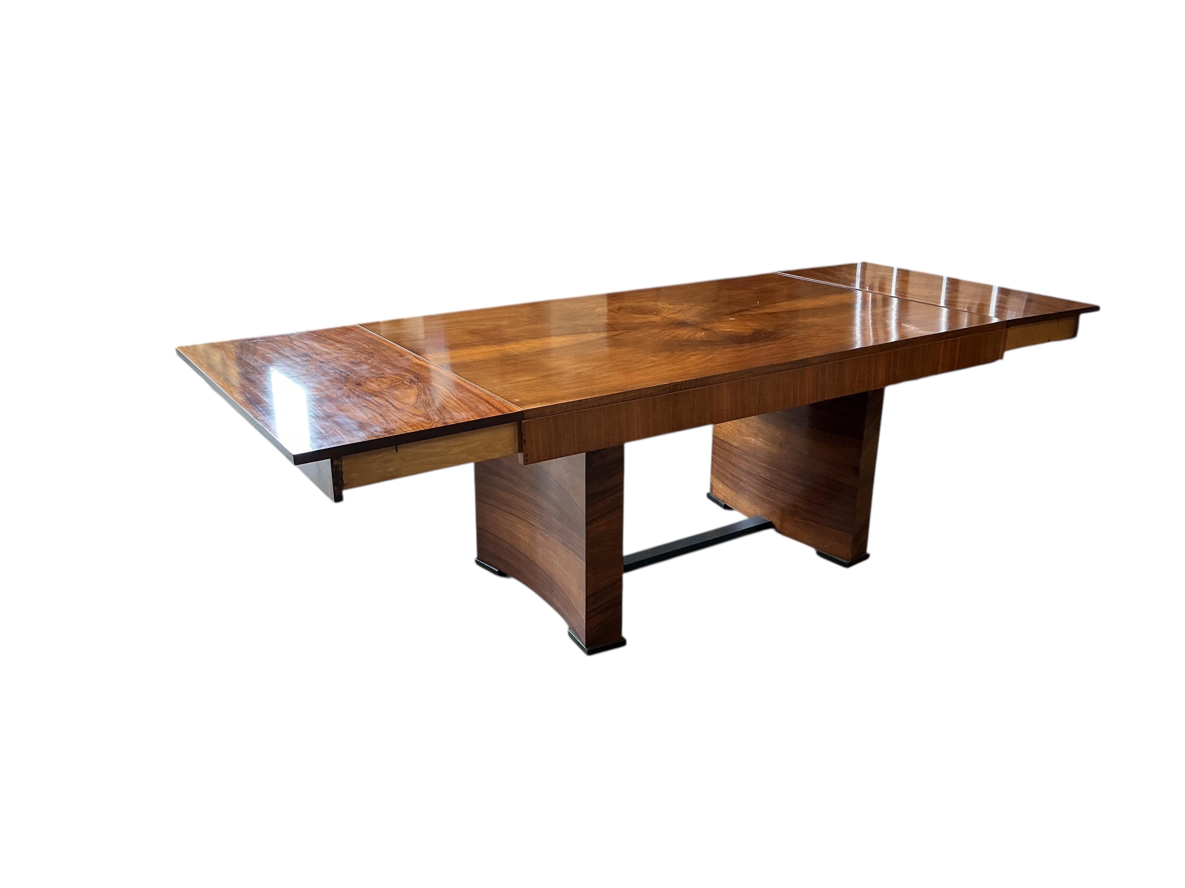 An Art Deco style rectangular walnut dining table, width 254cm extended, two spare leaves, depth 98cm, height 77cm together with six Empire style cherry dining chairs